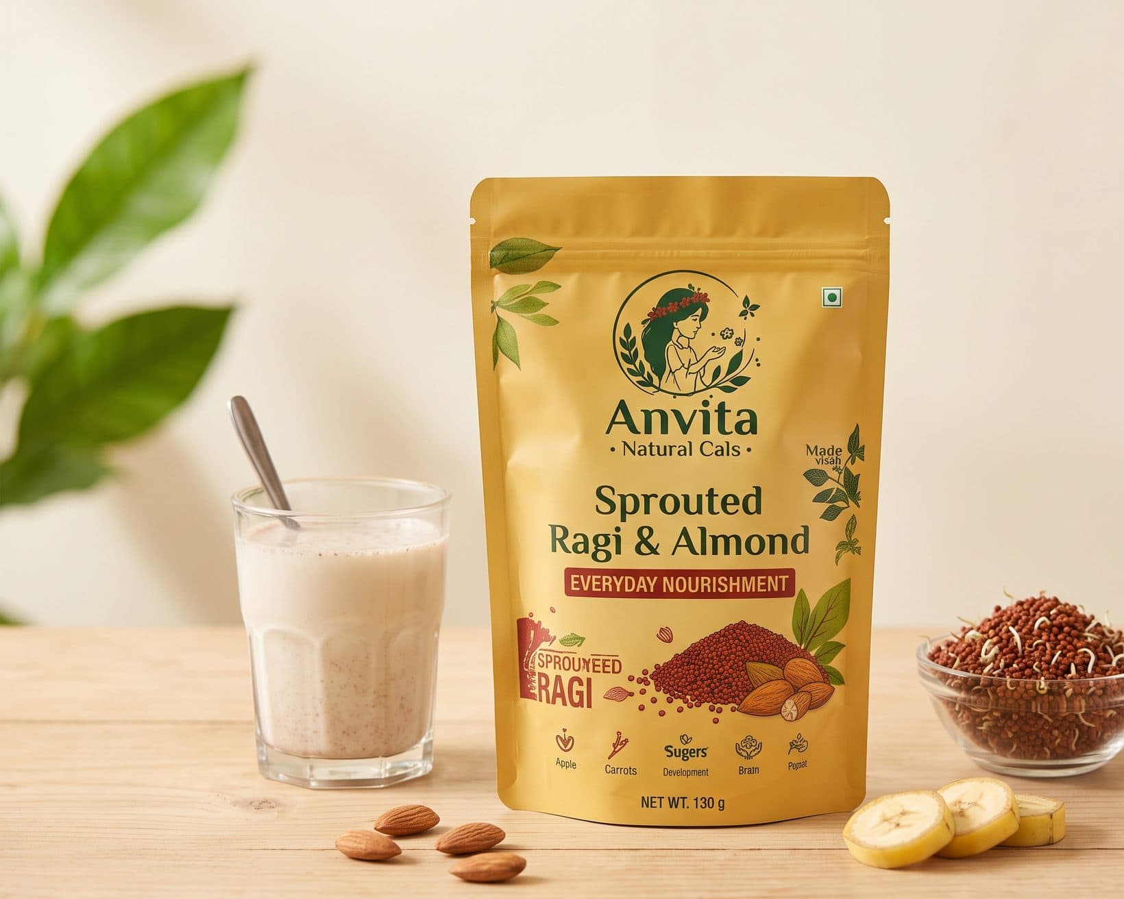 Sprouted ragi milk powder pouch with a glass of ragi milk, almonds and banana